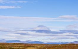 Clouds above mountain range landscape