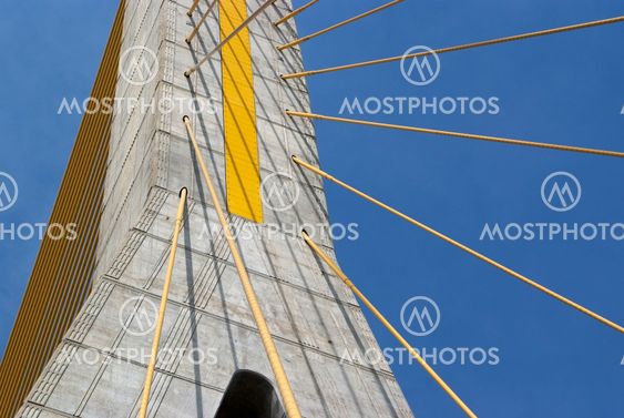 Detail of bridge construction over blue sky