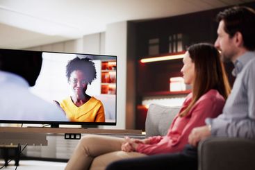 Evening Relaxation: Married Couple Enjoying Movie Night