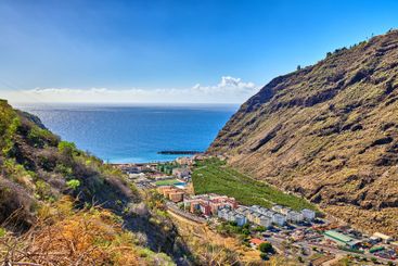 Mountain, ocean and valley with view of village outdoor...
