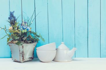 Shabby chic style home decorations on wooden background