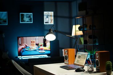 Modern home office in a stylish apartment with wooden...