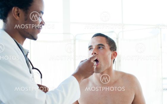 A doctor taking his patient's temperature