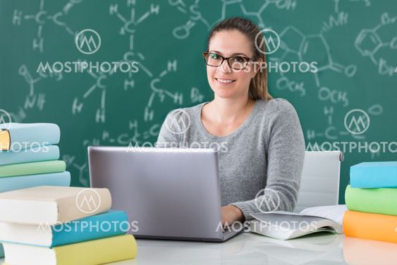 Woman Using Laptop In Classroom