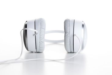 White headphones on white background close up