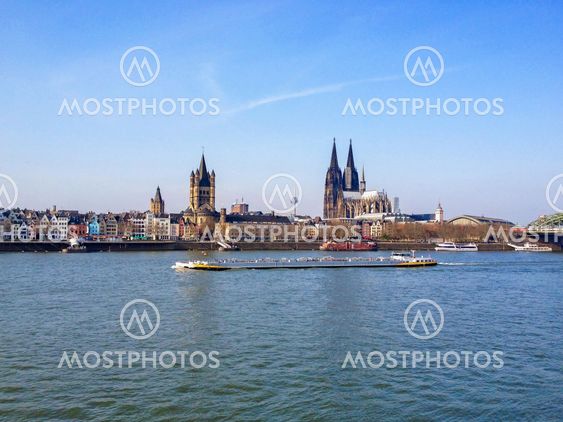 Cologne, Germany - FEBRUARY 08, 2012: Two Churches. St Martin Church and the great Cathedral standing together in the skyline,