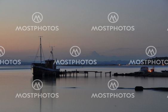 Old fishing boat at the old pier on Jomfruland