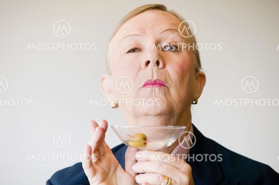 Dramatic Senior Woman with a Martini