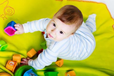 Little baby boy with toys