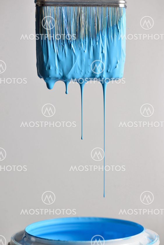 Dripping blue paint from brush