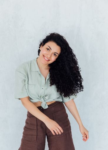 Beautiful slender brunette woman smiling sweetly