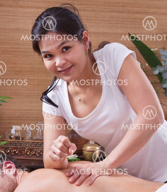 Asian Woman Making Massage To A Man Asian Woman Making Massage To A Man