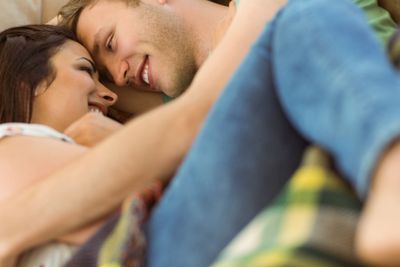Cute couple cuddling on couch