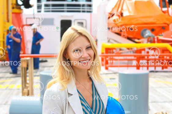 Woman engineer shipbuilder at the shipyard.