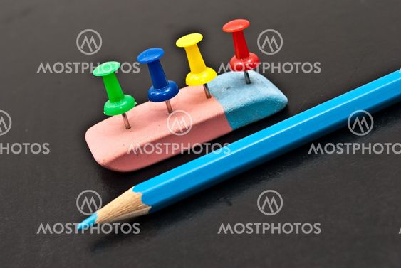 The Varicoloured office button,lasting and pencil.