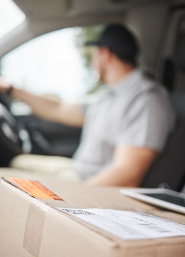 Label, delivery man or driving in car with box, scan...