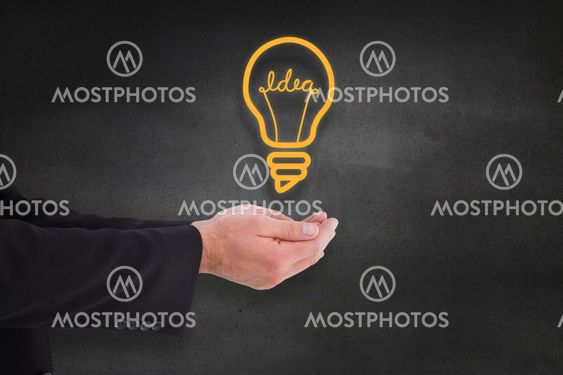 Composite image of businessman holding something with his hands