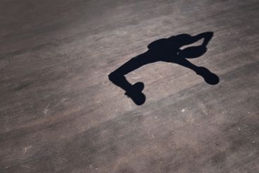 Shadow, basketball player and jumping with ball in court...