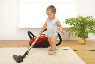 Baby boy with vacuum cleaner