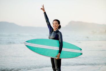 Happy woman, peace sign or surfer portrait at sea for...