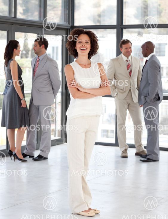 Cute Businesswoman arms folded with his colleagues
