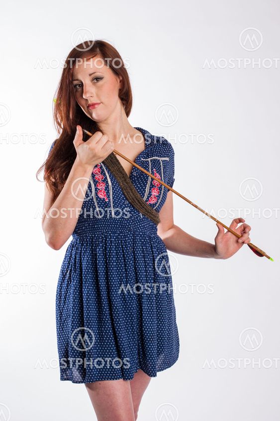 Woman with Red Hair Checks Arrow Tip