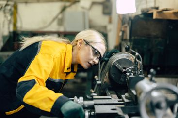 caucasian women worker working in heavy metal industry...