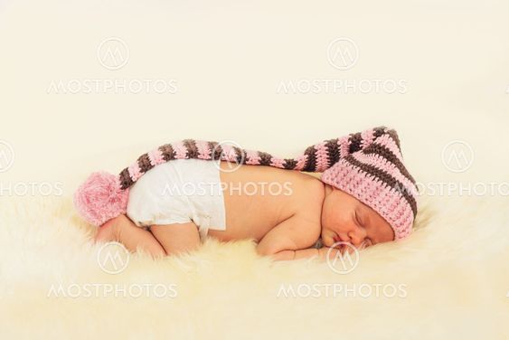 infant sleeping in the white sheep's clothing.