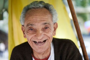 Face, senior man and happy with laugh in outdoor for...