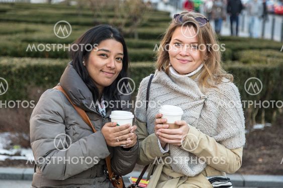 Two Young Women with Hot Beverage
