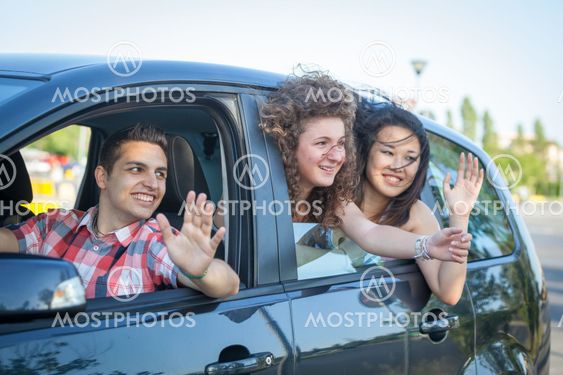 Boys and Girls in a Car Leaving for Vacation