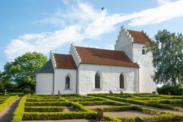 Tofta Kyrka white church in Skåne in summer