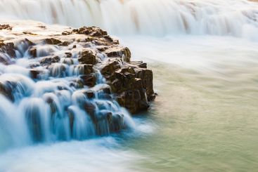 Majestic waterfall cascading over rocks in Iceland...