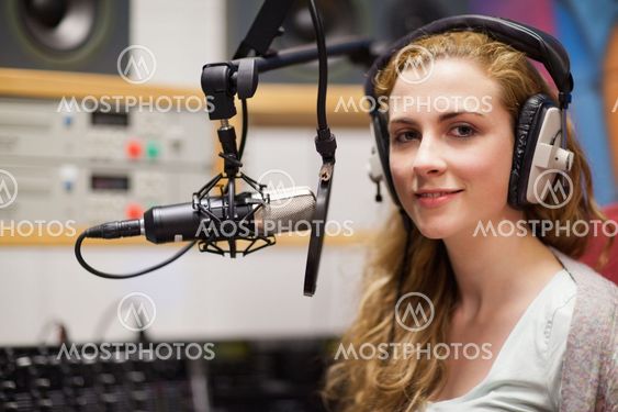 Young woman posing with a microphone