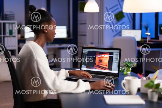 Dark skin gamer developer working at video game in midnight