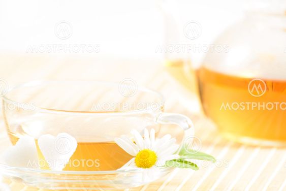 teacup with herbal chamomile tea