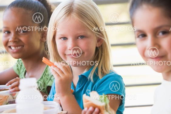 Kindergarten children eating lunch