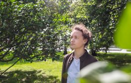 Portrait of teenage boy (16-17) in park