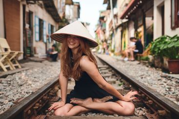 Travel, portrait and woman on railway for holiday,...