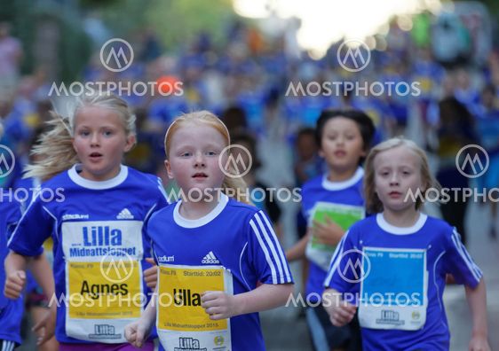 Group of young blonde girls running