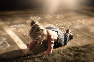 Little girl playing on the ground
