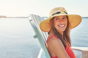 Happiness, beach and woman with joy, water and smile for...