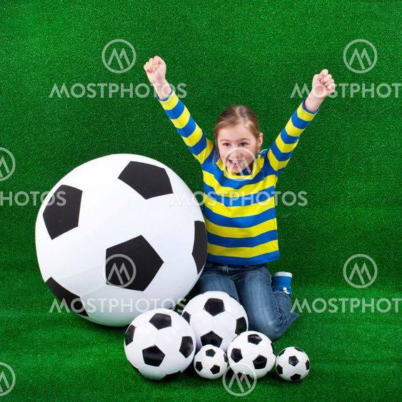 Happy girl with soccer ball