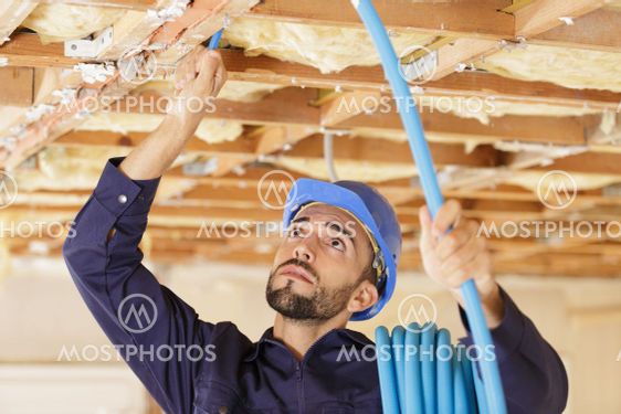 man working on ventilation system