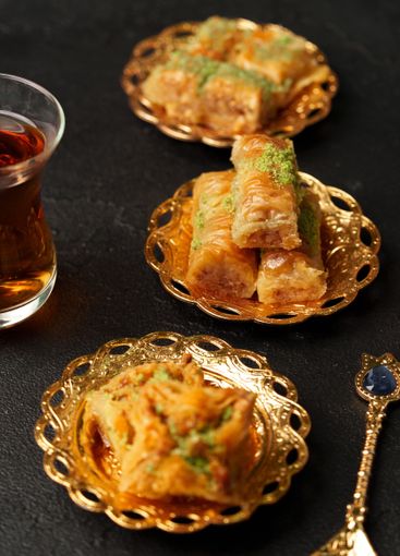 Traditional Middle Eastern desserts served on ornate...