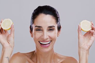 Portrait, lemon and woman with skincare, smile and...