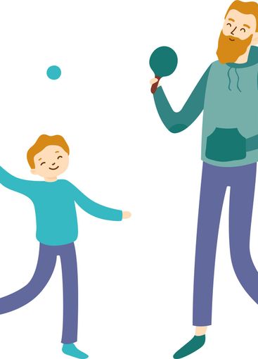 Father with a beard and son joyfully playing table...