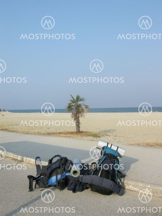 Two backpacks near the ocean - Arriving at destination