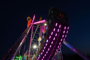 A colourful pirates boat  in Luna park during night.