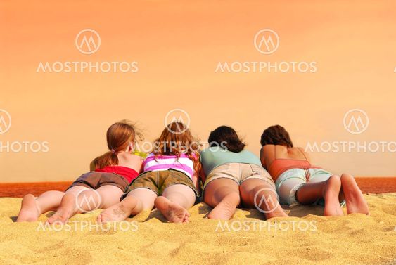 Four girls at orange sea